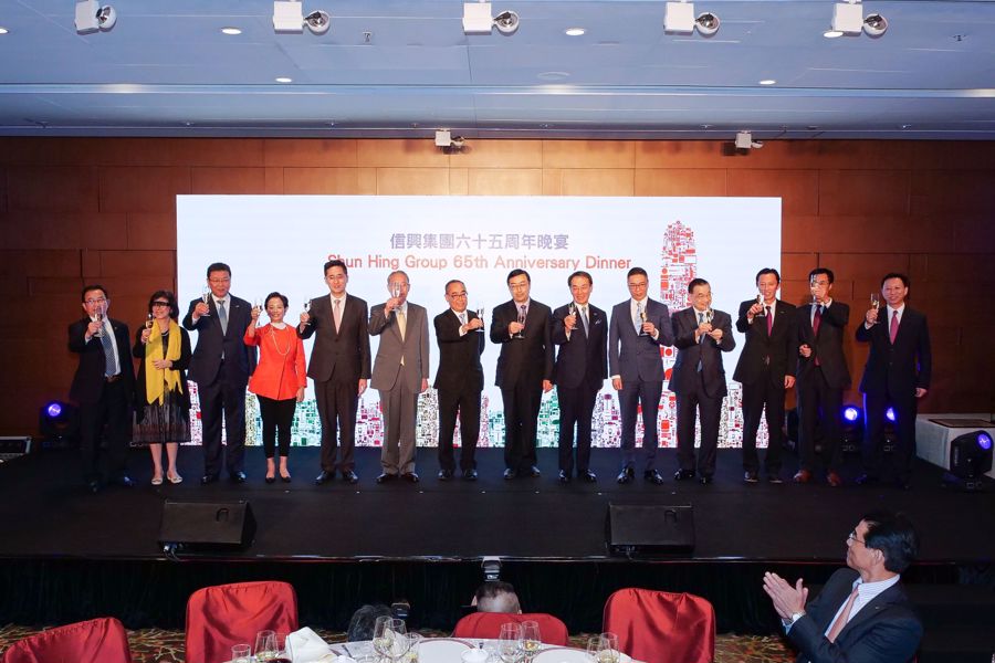 All officiating guests hosted a toasting ceremony in celebrating Shun Hing Group 65th Anniversary. (From the left) Mr Edmond Ng, Business Controller of Shun Hing Group, Ms Cheung Man Yee, Vice Chairman of Shun Hing Education and Charity Fund, Mr Yoshio Ito, Vice President of Panasonic Corporation, Ms Cynthia Mong, Executive Director of Shun Hing Electronic Trading Co., Ltd, Dr Bernard Chan, Under Secretary for Commerce &amp; Economic Development of HKSAR, Mr Kuninori Matsuda, Consul General of Consulate-General of Japan in Hong Kong, Mr David Mong, Chairman and CEO of Shun Hing Group, Mr Shen Chong, Director General of the Coordination Department of Liaison Office of the Central People’s Government of HKSAR, Mr Kazuhiro Tsuga, President of Panasonic Corporation, Mr Peter Shiu, Legislative Council Member, Mr Terrence Chan, Vice Chairman of Shun Hing Group, Mr Sadaaki Yokoh, Executive Officer, Regional Head for China &amp; Northeast Asia of Panasonic Corporation, Mr Simon Tam, Group Financial Controller of Shun Hing Group and Mr Nelson Lai, Group Human Resources Director of Shun Hing Group.