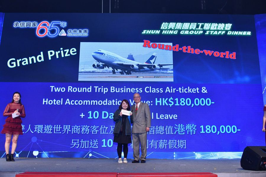 Mr David Mong presented the two round trip business class air-ticket &amp; hotel accommodation package with 10 days paid leave, valued at $180,000, to the lucky draw winner.